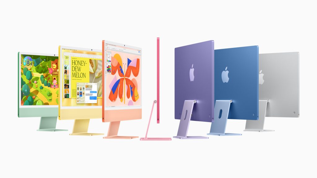 iMacs in all of the colors on a white background